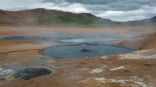 Steaming and Bubbling Mud Pool in the Hverir Geothermal Area in Iceland