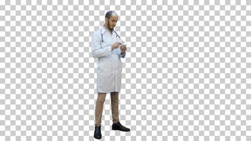 Male doctor attentively reading label, Alpha Channel