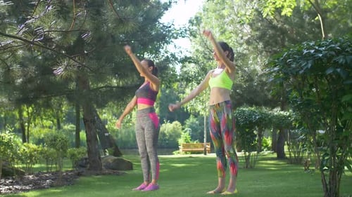 Smiling Fit Sporty Women Working Out in Park