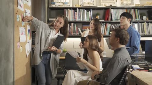 Team Celebrates Success in Modern Office