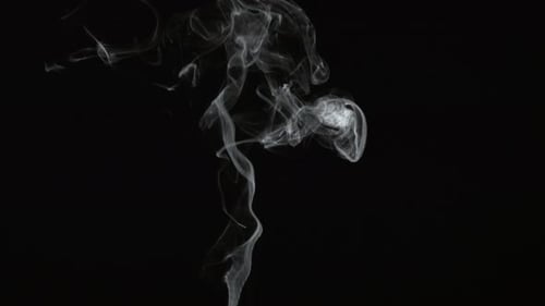 Wispy White Smoke Rising on Black Background
