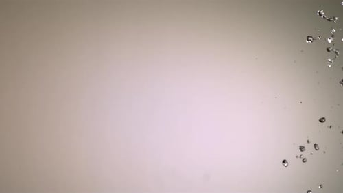 Transparent Water Splashing Across Frame