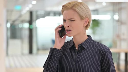 Woman Talking on Cell Phone Getting Upset