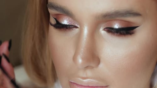 Woman Receiving Professional Mascara Application in Close Up