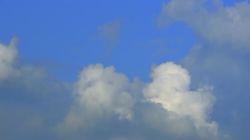 Blue sky with fluffy cloud time lapse on a sunny day 4k footage.