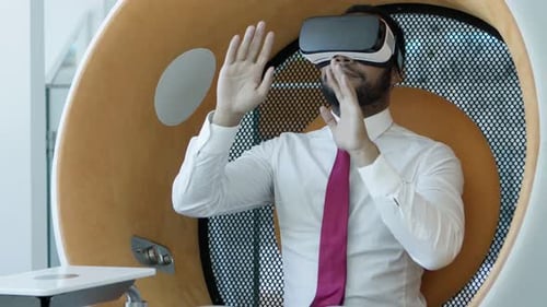 Man Exploring Virtual Reality in a Modern Office