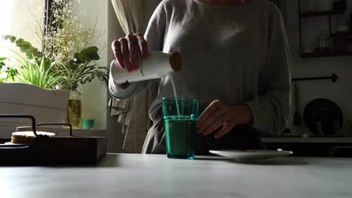 Woman and glass of coffee with milk