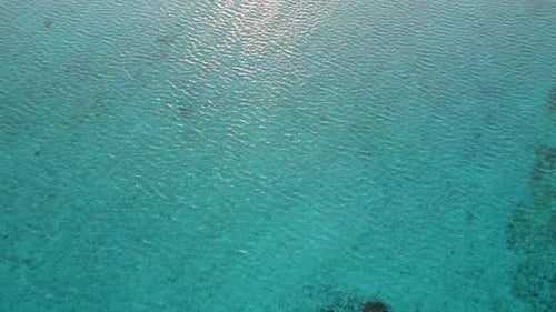 Sunny nature of sea view beach by blue sea and sand background near waves
