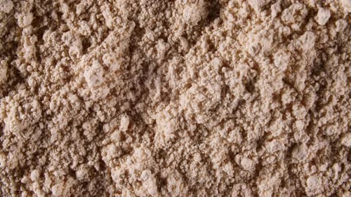 Motion of the Dry Mask Made of Clay Powder Cosmetic Texture with Rotation