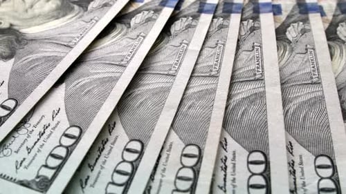 Close-Up of Stacked One Hundred Dollar Bills