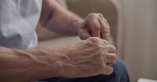 Senior Adult Taking Medication from Pill Organizer