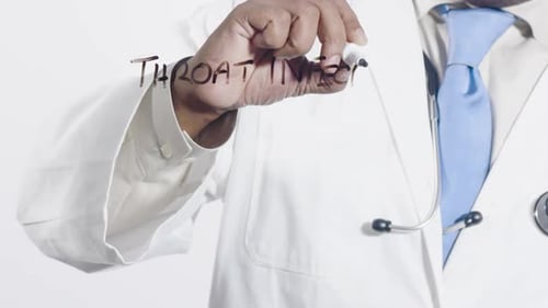 Doctor Writes Throat Infection On Clear Surface