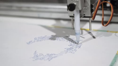 Drawing Machine Creates Intricate Artistic Design on Paper