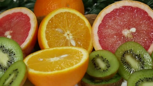 Colorful Sliced Citrus Fruits and Kiwi Close-Up
