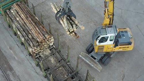 Timber loader at wood processing plant, aerial view