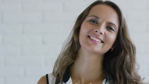 Portrait of Beautiful Smiling Woman with Brown Hair