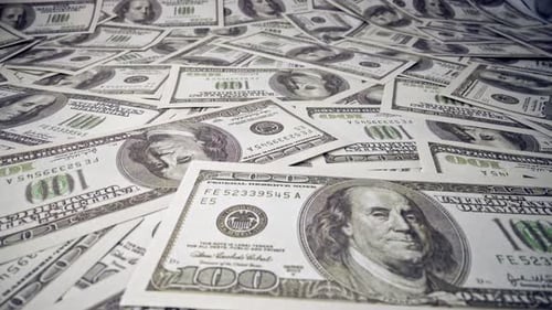 American One Hundred Dollar Paper Banknote Pile on Office Desk