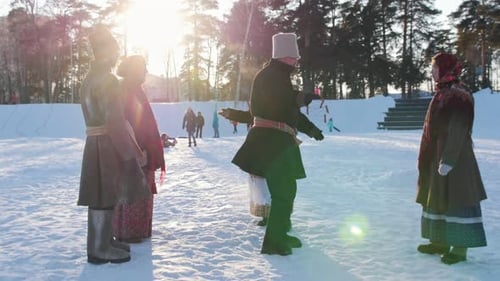 Russian Folk - Man Is Dancing Traditional Dance in a Circle of Women in Winter