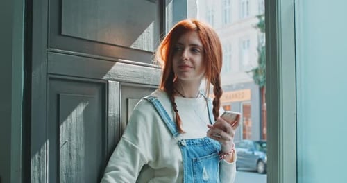 Woman with Red Hair Listening to Music
