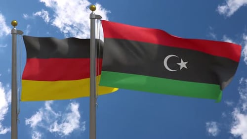 Germany and Libya Flags Waving in Wind