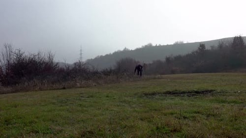 Hiker Walk On A Path Full Of Fog In Autumn