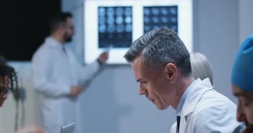 Medical Professionals Collaborate During Healthcare Presentation