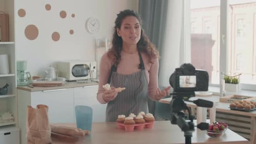Woman Decorating Cupcakes and Recording with Camera