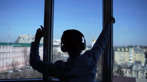 Person Dancing near the Window
