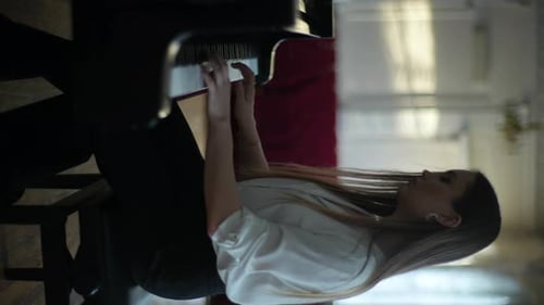 Woman Plays Piano at Home