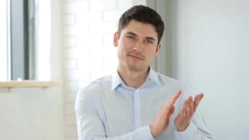 Applauding Clapping Businessman in Office