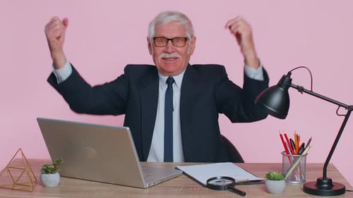 Senior Business Office Man Analyzes Financial Charts Celebrate Success Win at Home Workplace Desk