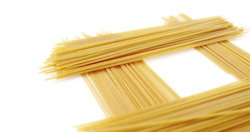 Close-Up of Raw Spaghetti on a White Surface