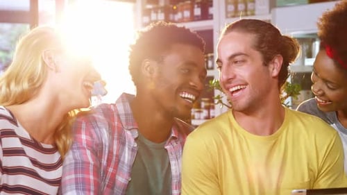 Group of Friends Laughing at Coffee Shop