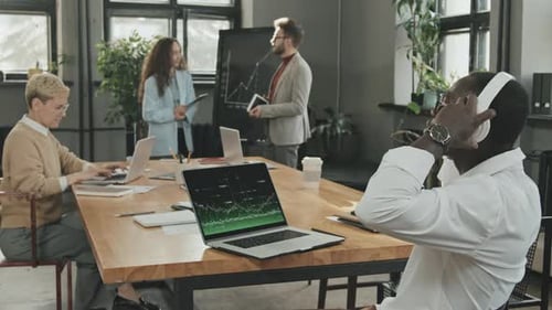 Team Working Together in Modern Office with Technology