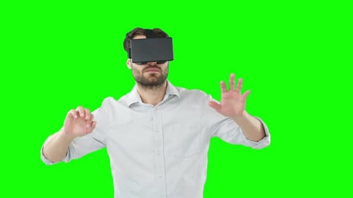 Man with VR Headset Interacts on Green Screen