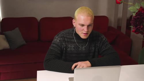 Smiling Homosexual Man Talking Video Call Conference on Laptop at Home Office