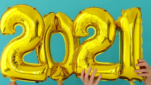 Gold Number Balloons Spelling Out 2021 for Celebration
