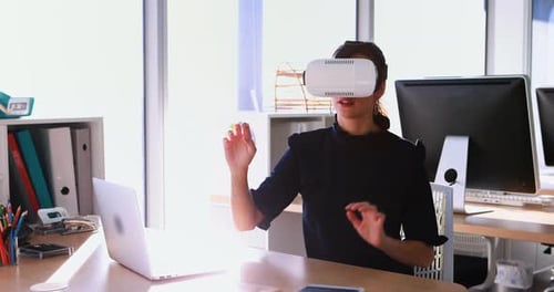 Woman Using VR Headset in Modern Office