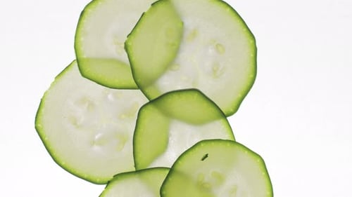 Zucchini Slices Falling, Close Up Food Footage