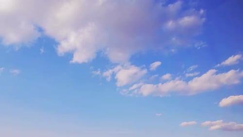 White Clouds Floating Across the Blue Sky
