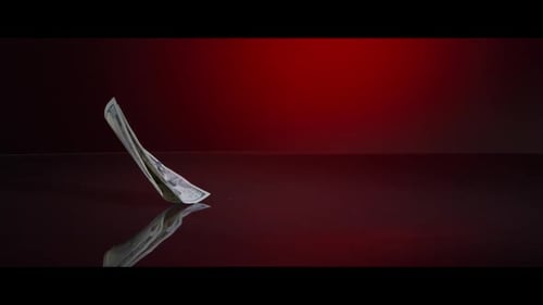 American $100 Bills Falling onto a Reflective Surface - MONEY 0025