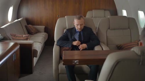 Businessman Inside of Private Jet Luxury Interior