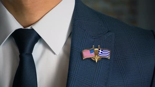 Close Up of Suit with USA and Greek Flag Pins
