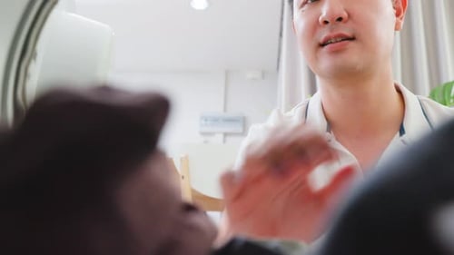 Man Unloads Laundry From Washing Machine