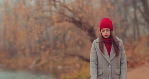 Young Woman Walking in Autumn Nature