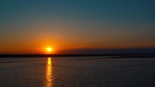Panoramic Seashore View with Dramatic Golden Sunset