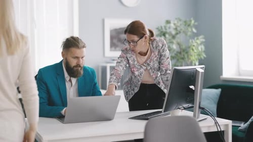 Team of Managers Talking in Office