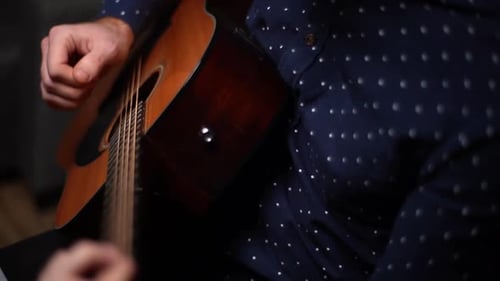 Closeup Hands of Unrecognizable Guitarist Male Playing on Acoustic Guitar at Home Recording Studio