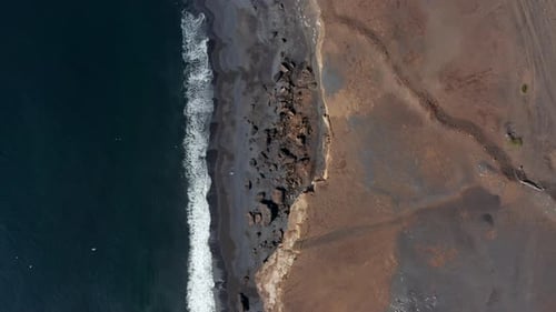 Top Down Flying Towards Amazing Black Beach in Iceland