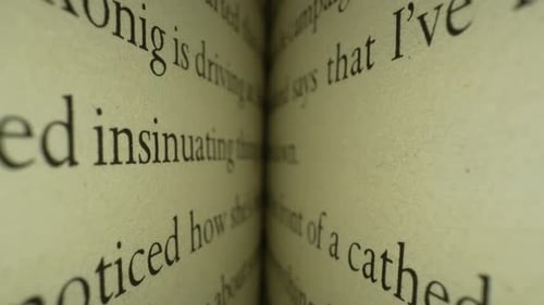 Close-Up View of Book Pages with Black Text